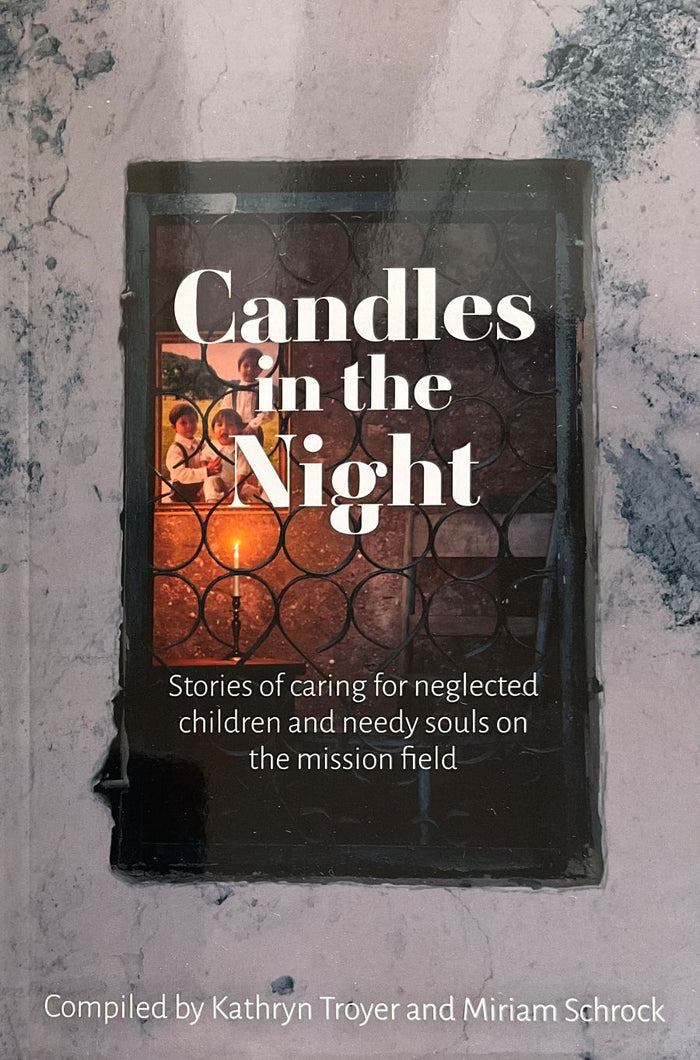 Book titled 'Candles in the Night' on a textured surface