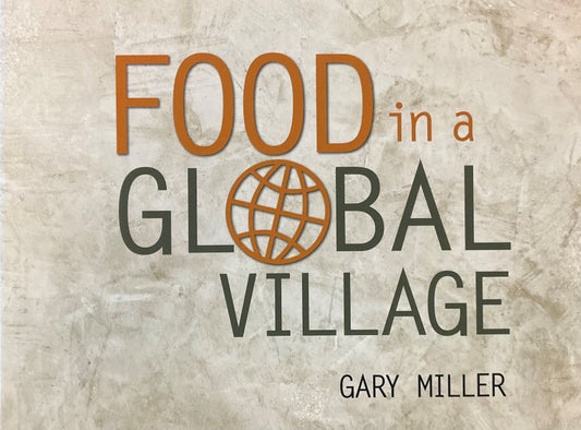 Front cover of Food in a Global Village by Gary Miller.