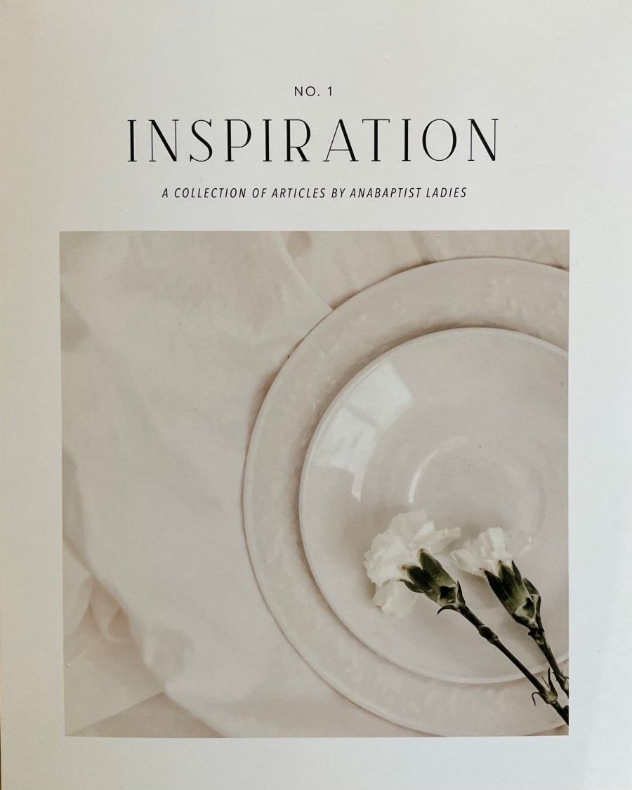 Cover of 'Inspiration' collection with floral arrangement on a textured background