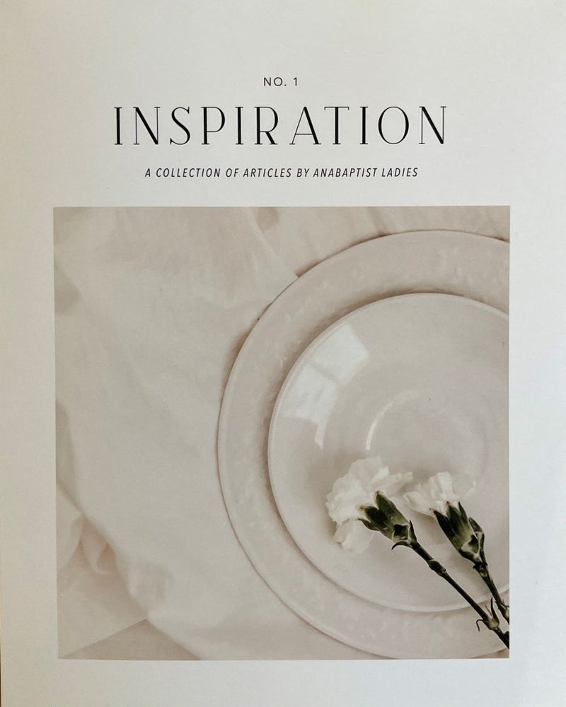 Cover of 'Inspiration' collection with floral arrangement on a textured background