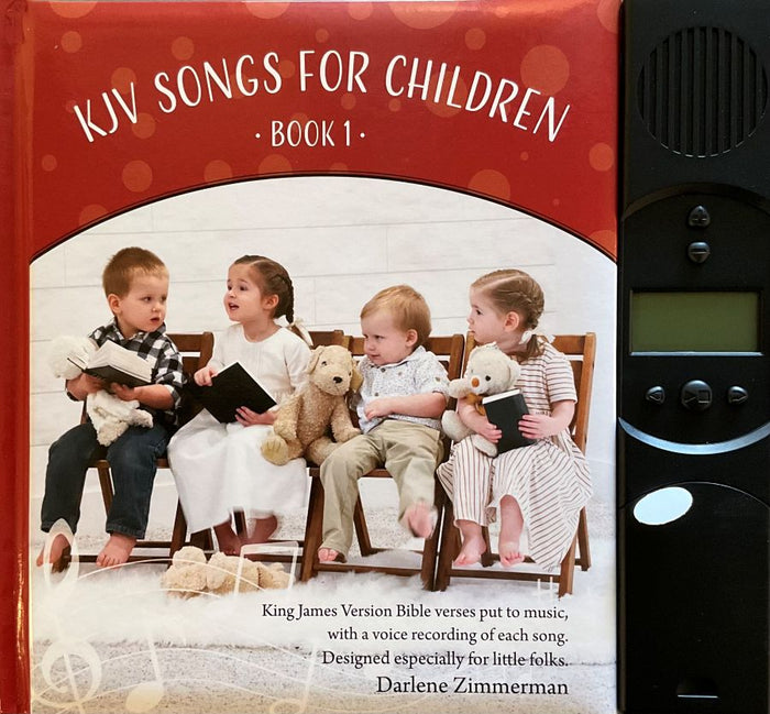 Book titled 'KJV Songs for Children Book 1' with children and teddy bears on the cover, next to a black electronic device.