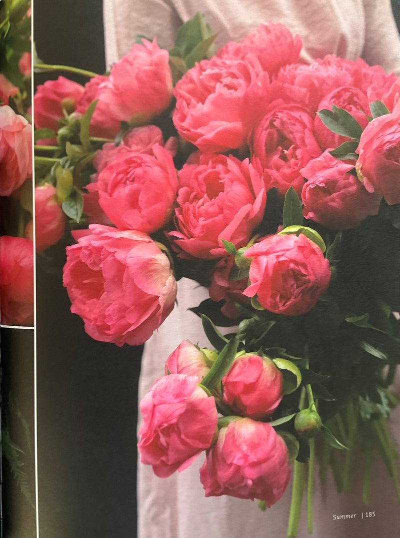 Bouquet of pink flowers with green leaves on a white background