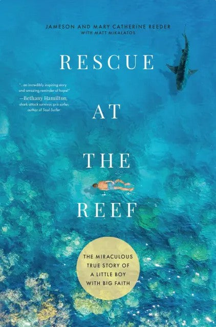 Book cover of 'Rescue at the Reef' with a diver and shark illustration.