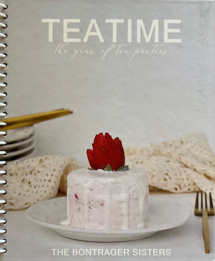 Book cover of 'Teatime: The Year of Tea Parties' by The Bontrager Sisters featuring a small cake with a red flower on a white plate.